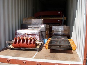 Screener components being loaded into a container for shipment to Australia,